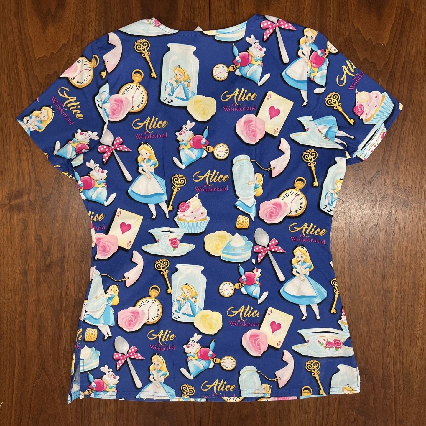Lot of 4 Disney Scrub Tops Dumbo Little Mermaid Alice in Wonderland Peter Pan