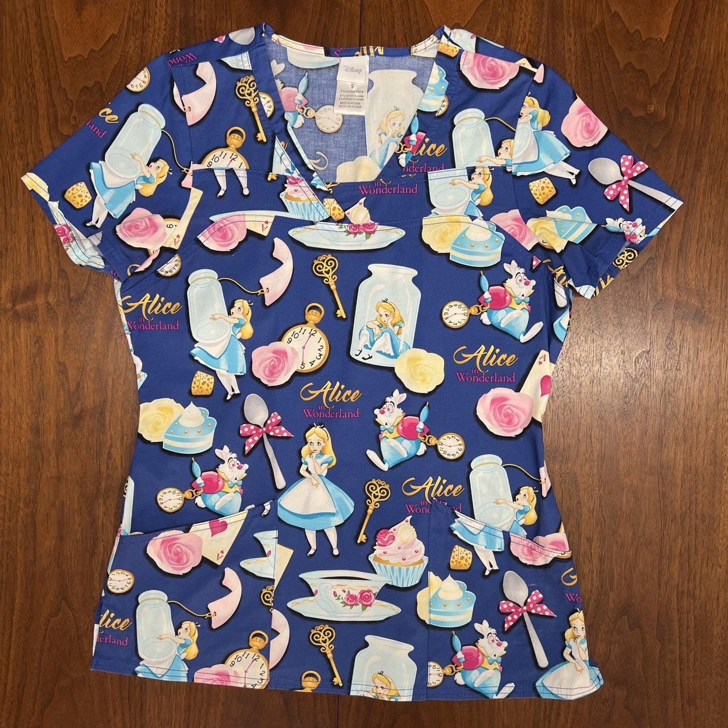 Lot of 4 Disney Scrub Tops Dumbo Little Mermaid Alice in Wonderland Peter Pan